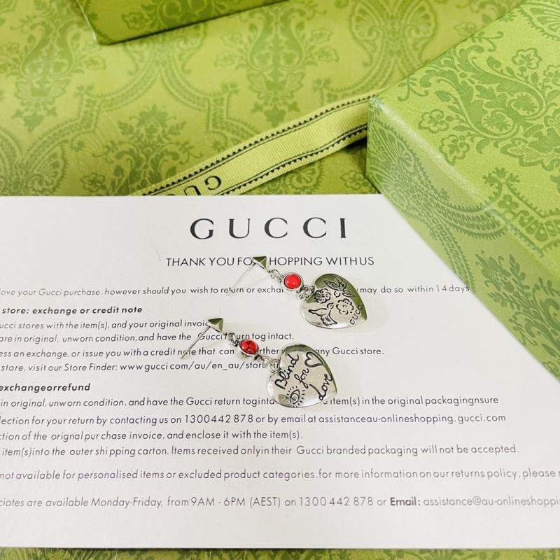 G*u*i earrings